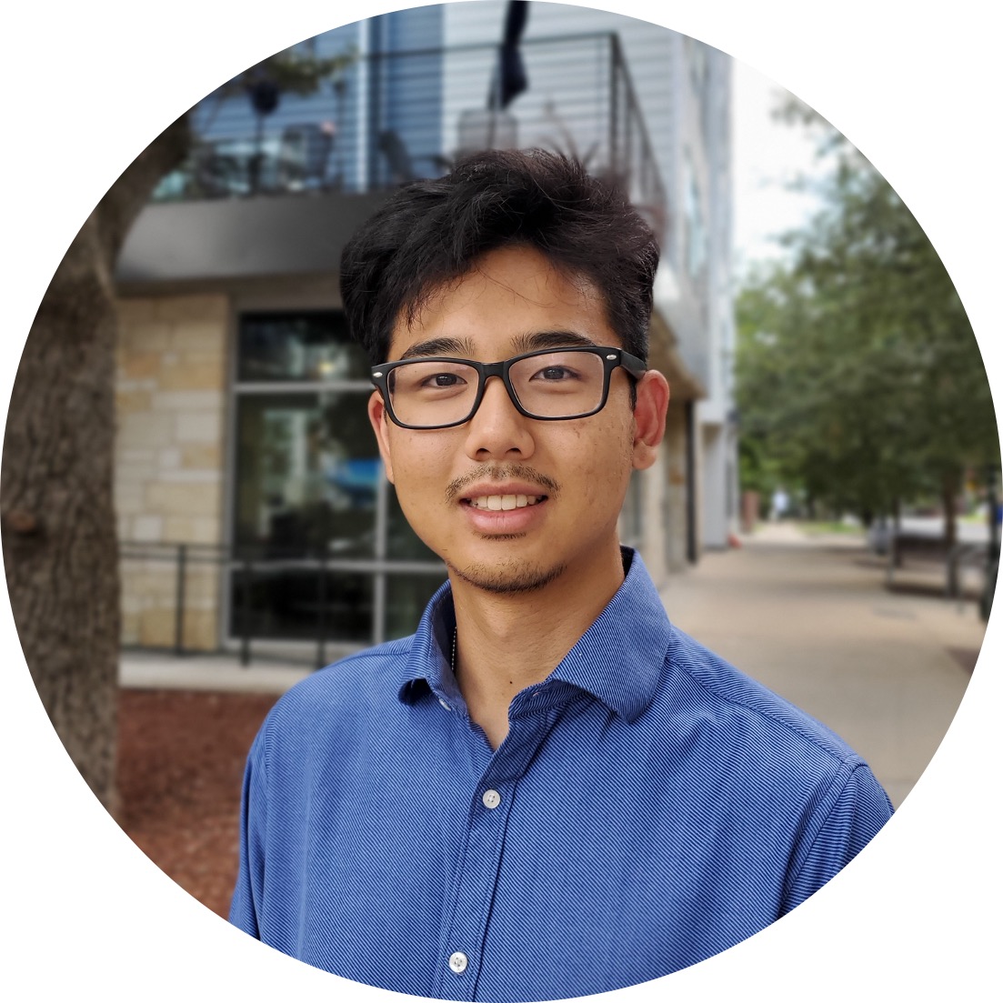 Axel Jeconiah, smiling outside of the EER building at UT Austin